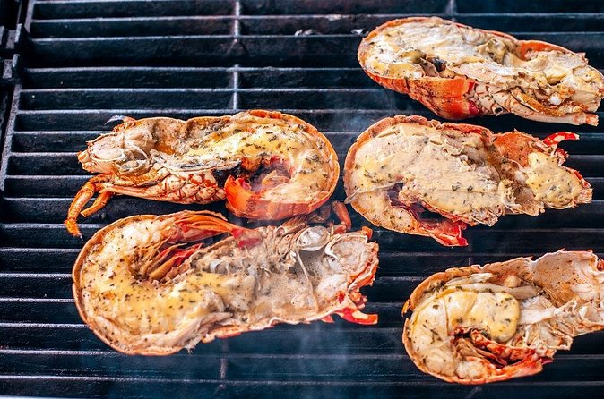 Antigua Seafood Lunch Cruise From St. John's - Sparkling wine, Caribbean music, and a party mood