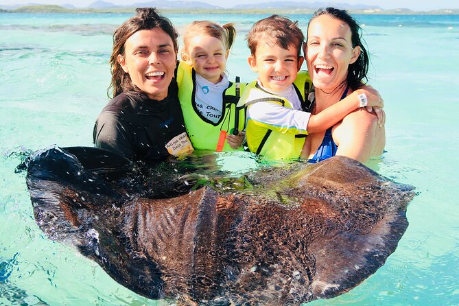 Stingray City Antigua for all the ages - ROUND TRIP INCLUDED - Standing waist-deep with the stingrays
